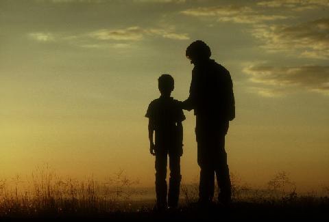 silhouette of man and boy