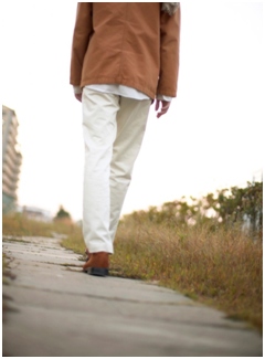 walking down a sidewalk